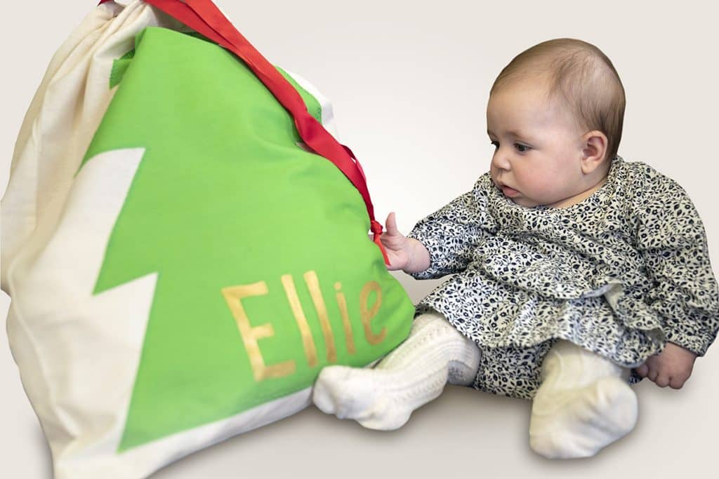 Baby Ellie with her Present for You Santa Bag